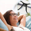 A woman smiling while wearing black eyeglasses with silicone anti-slip nose pads.