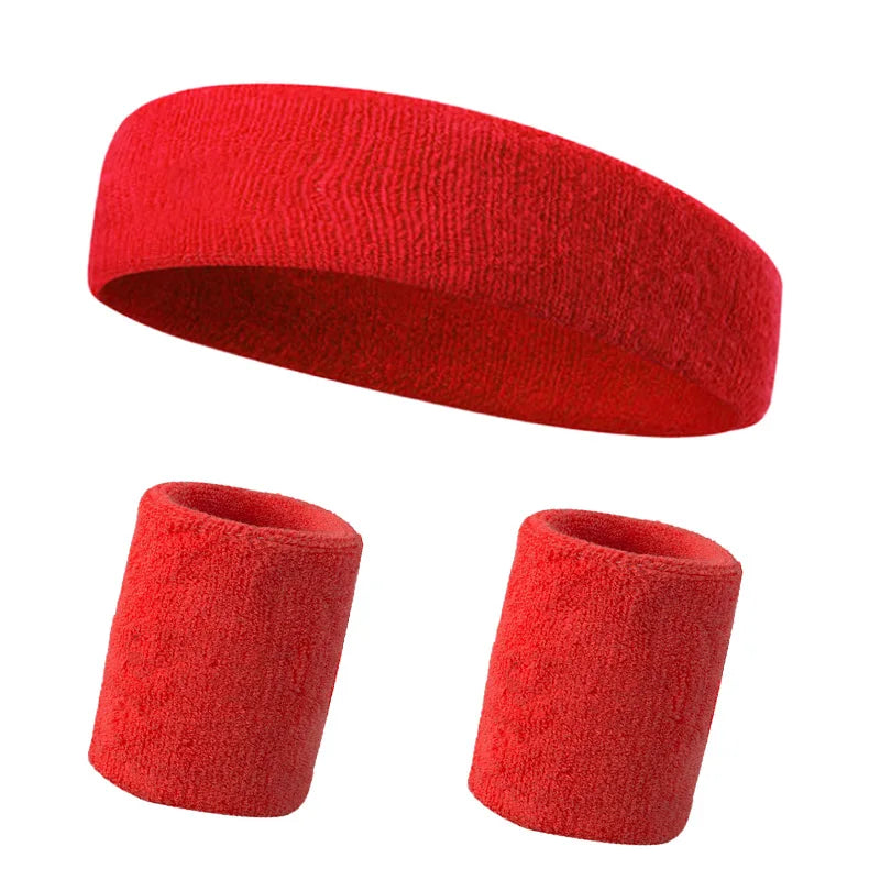 A set of three bright red knitted sports headbands for fitness and activity