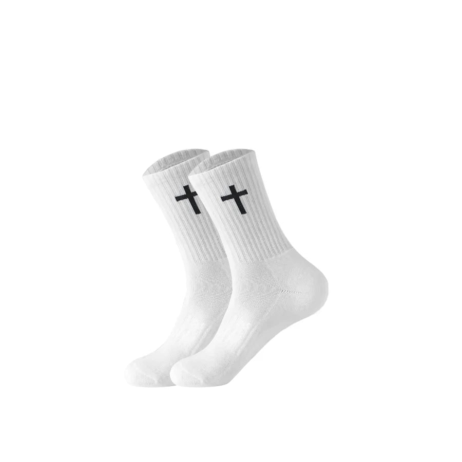 A pair of white knit mid-calf sports socks with black cross patterns shown from the side.