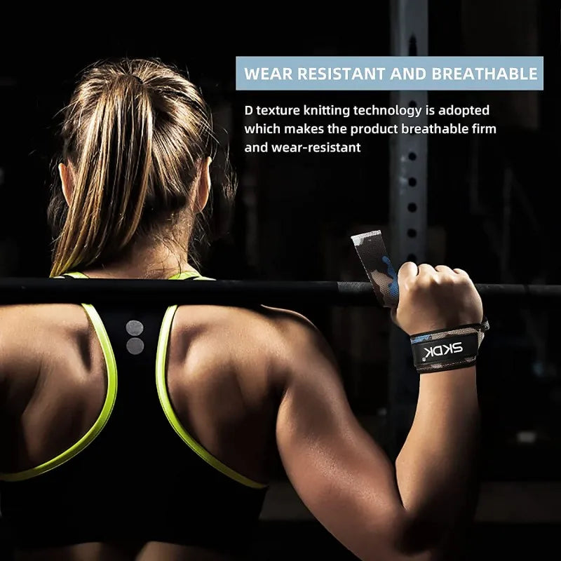 A person wearing black gym attire is using a black and silver weightlifting strap on their wrist.