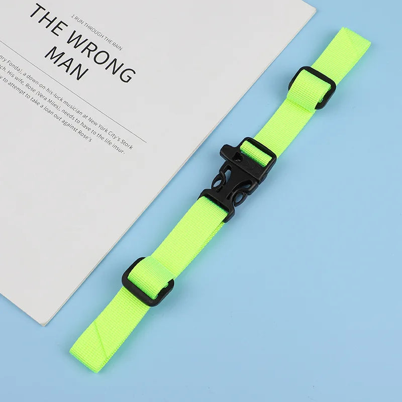 A bright neon yellow adjustable tactical backpack strap harness lying on a white paper with text.