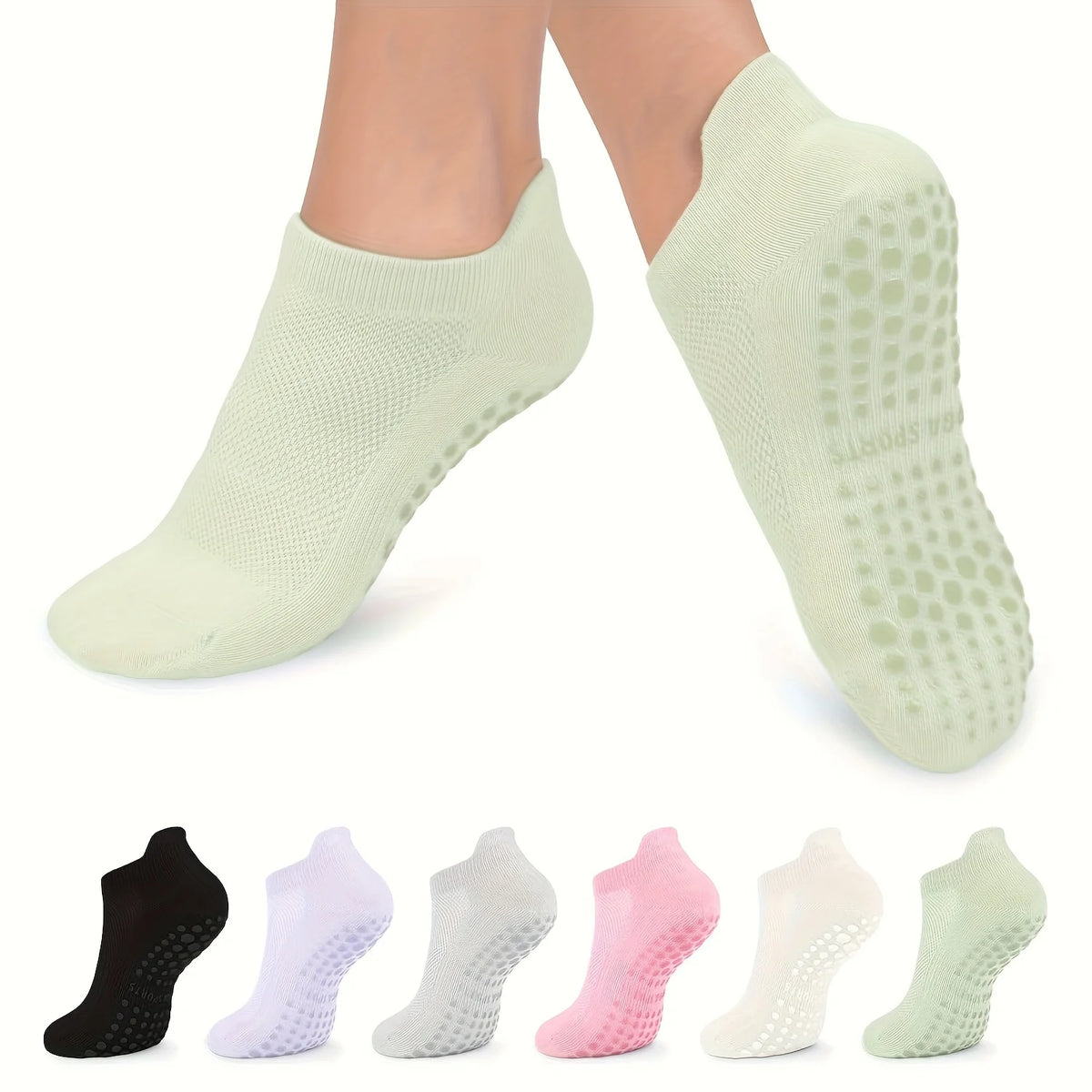 A set of light green grip Pilates socks for yoga and barre, shown from the top view.
