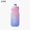 A pink and blue squeezable cycling water bottle with a light blue cap.