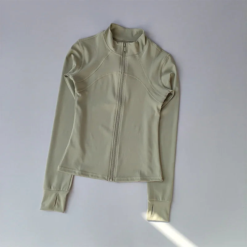 A light beige quick-dry yoga and fitness jacket shown flat lay.