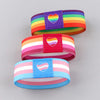 Three colorful stretch wristbands featuring the rainbow and pride flag designs.