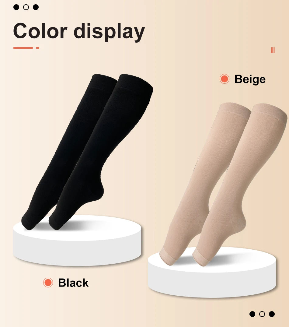 Two pairs of medical grade knee high compression stockings in beige and black displayed on a light background.