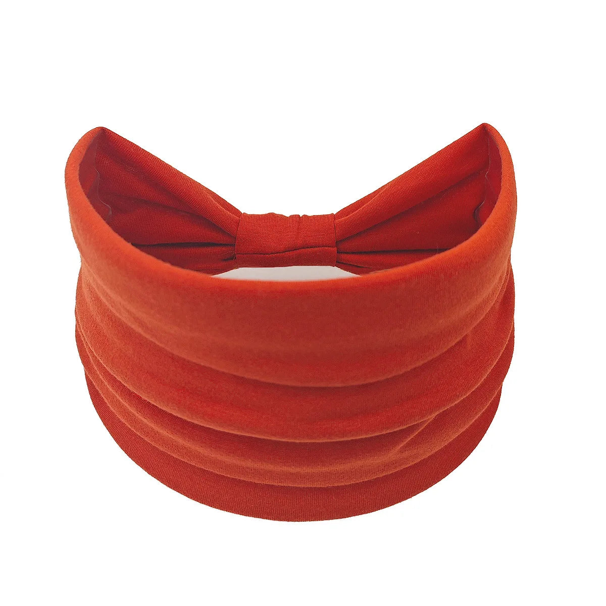 A wide, orange-red fabric headband or hair wrap for women.
