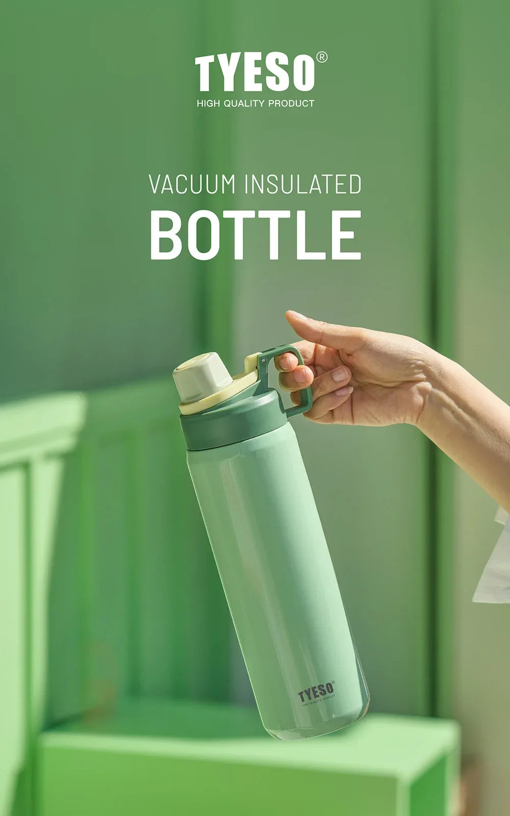 A hand holds a light green vacuum insulated bottle with a silver cap against a blurred green background.