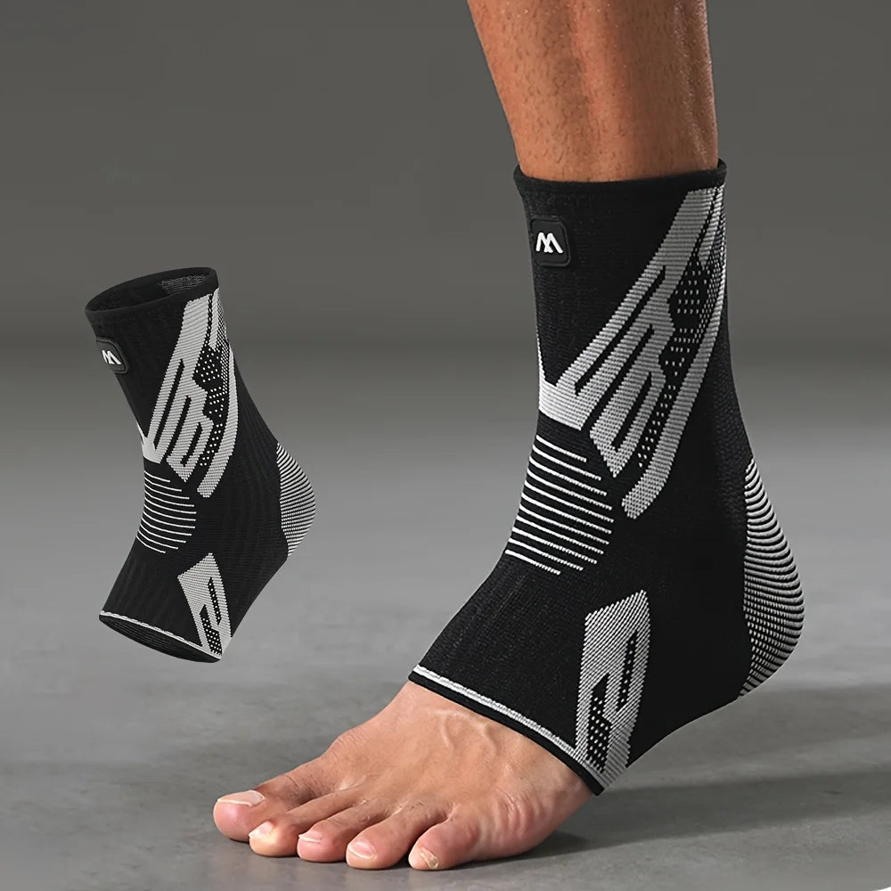 A close-up of a person's lower leg wearing black compression sleeves with white geometric patterns.