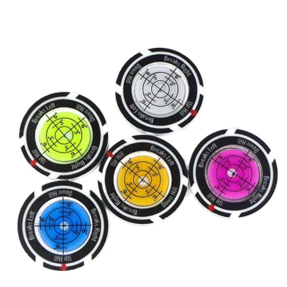 A set of precision golf ball markers and slope meters showing different angles and directions.